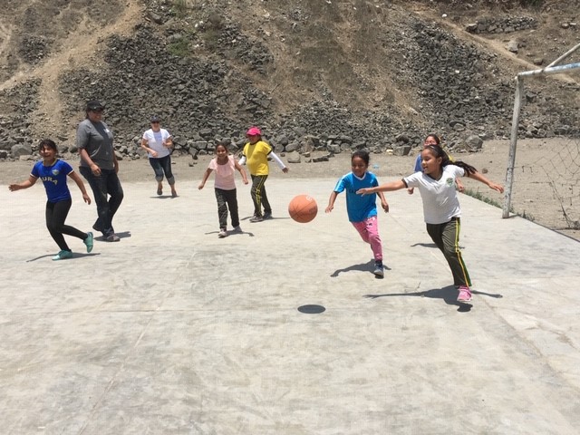School children in Peru playing soccer