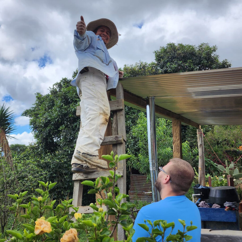 Guatemala local helper on ladder