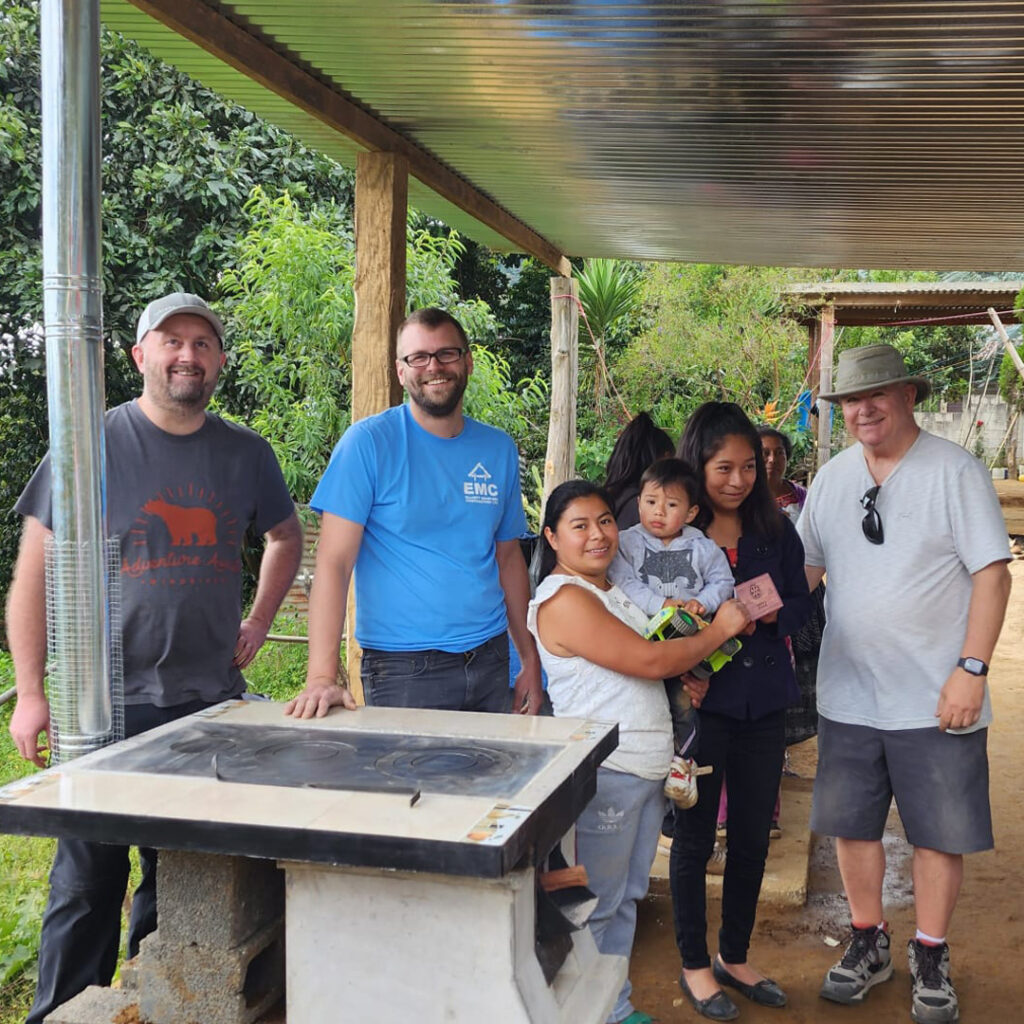 Family and volunteers after eco stove installation