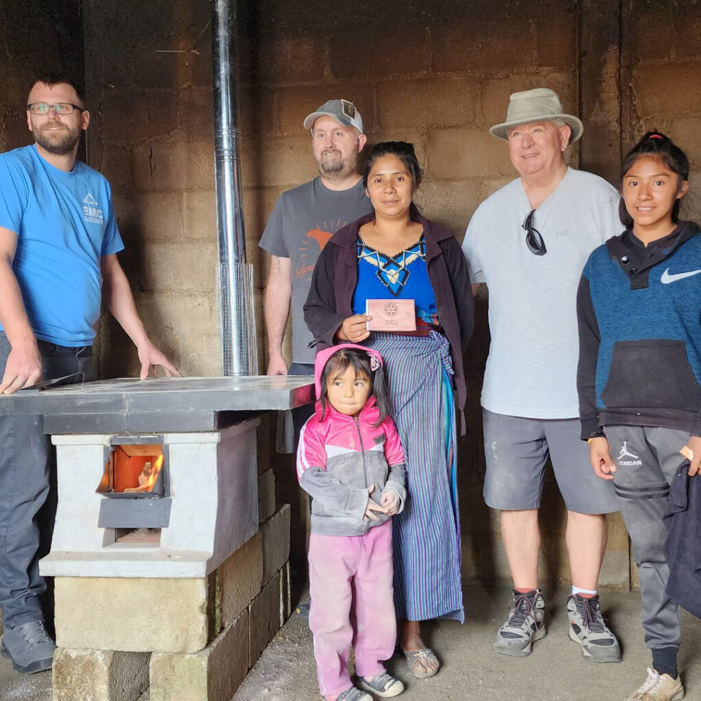 Family and volunteers after eco stove installation