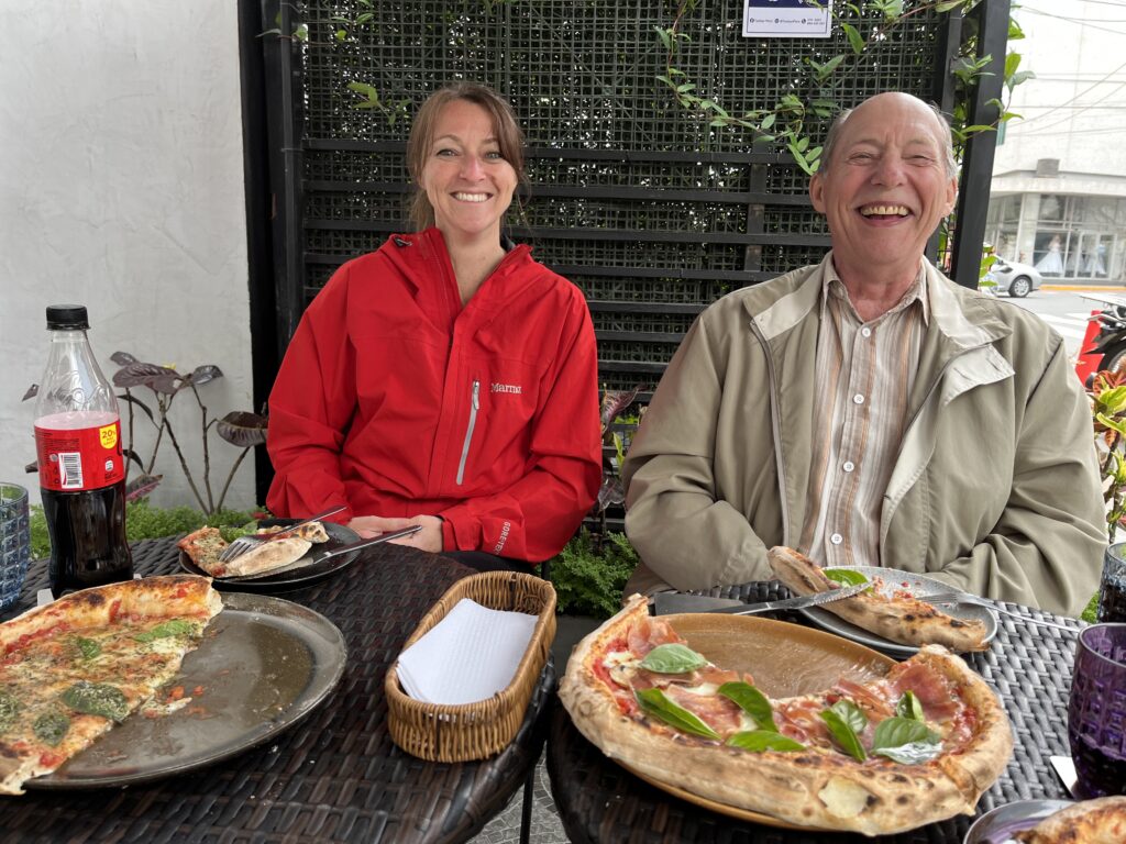 Volunteers eating pizza in Lima
