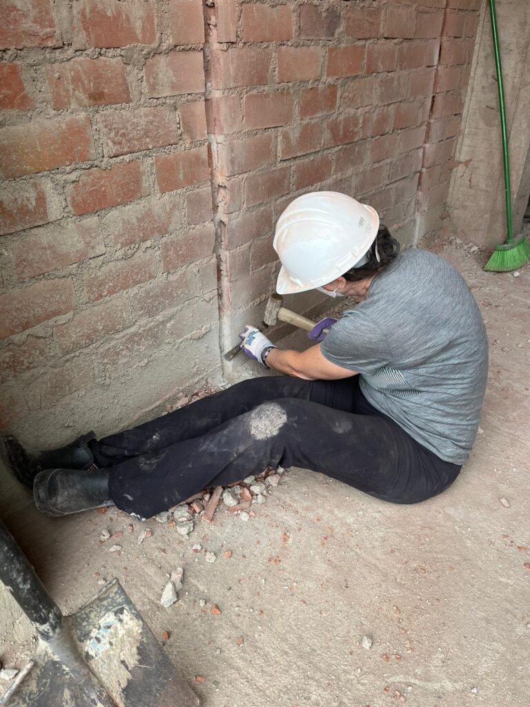 DWC volunteer working on school construction