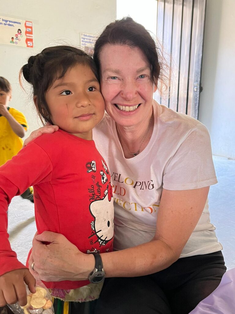 DWC volunteer with Peru schoolchild