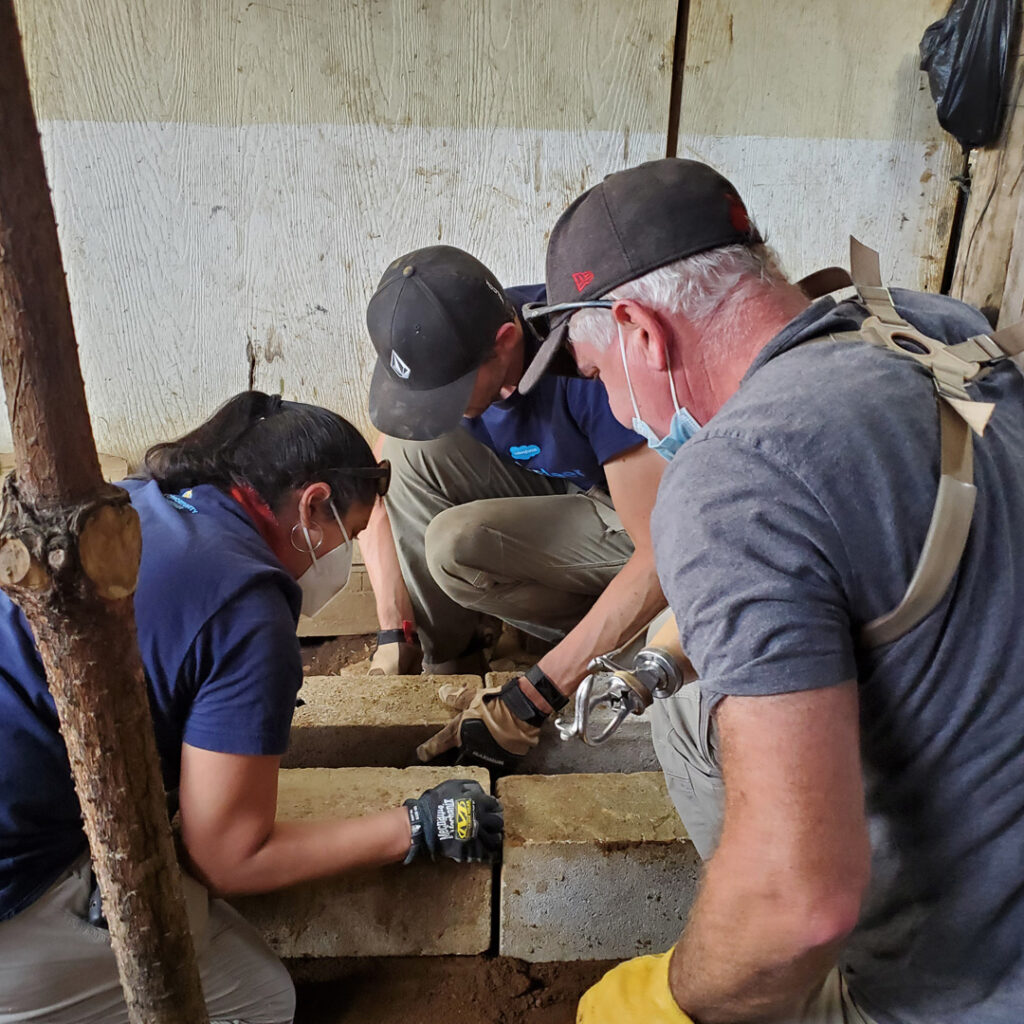 Salesforce volunteers installing Eco stove in Guatemala