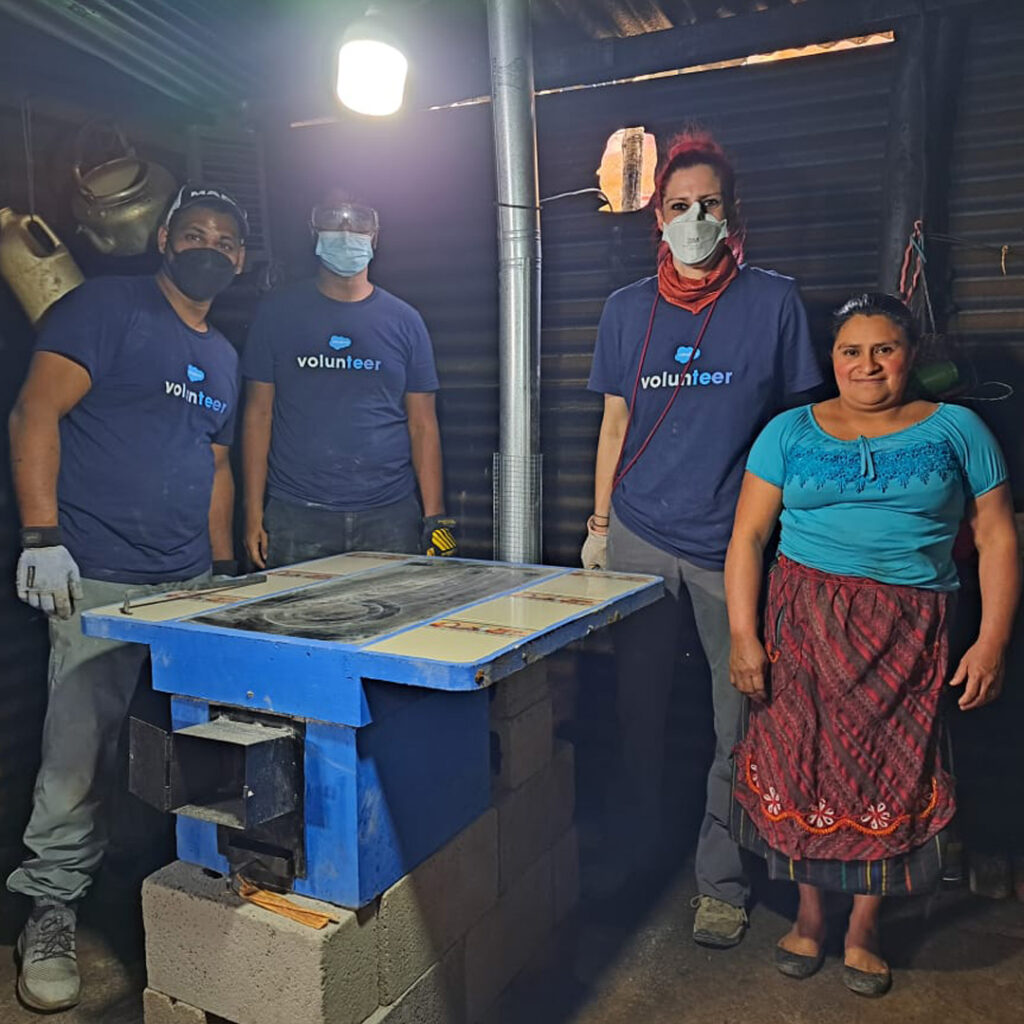Salesforce volunteers installing Eco Stove in Guatemala