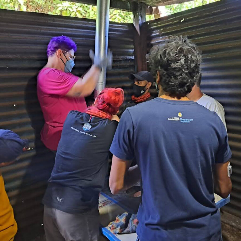 Salesforce volunteers in Guatemala installing Eco stove