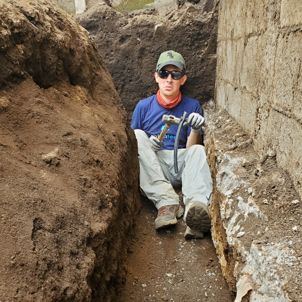 Salesforce volunteer in foundation trench