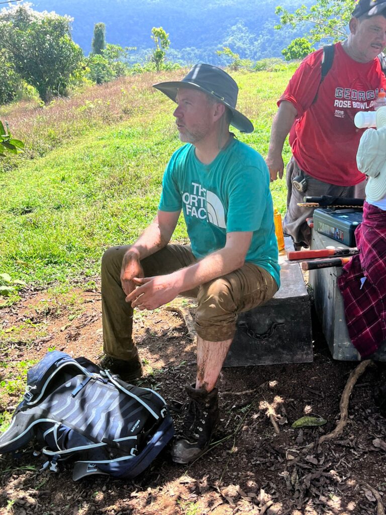 Volunteer sitting on tool box Costa Rica