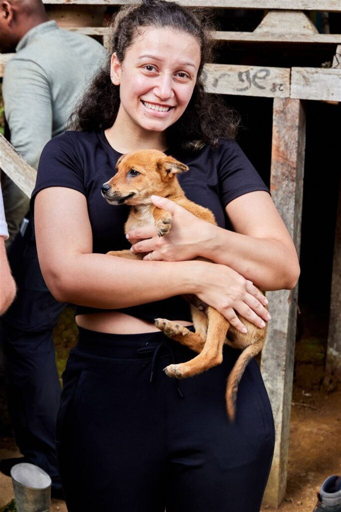 DWC volunteer holding puppy in Costa Rica