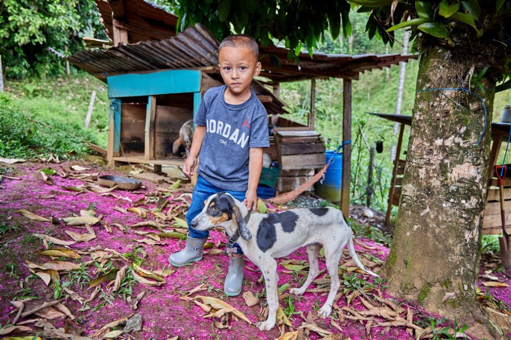 Local boy with dog in Costa Rica