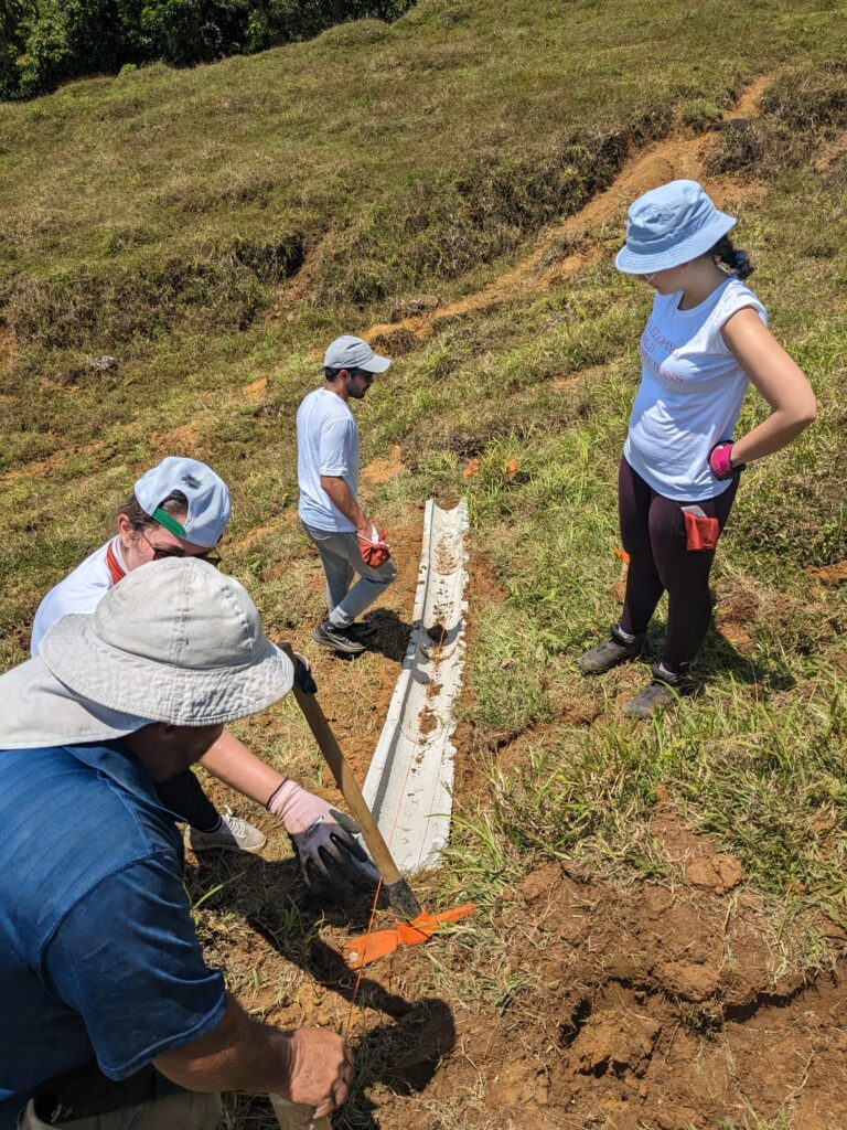 Volunteers in Costa Rica assembling trough