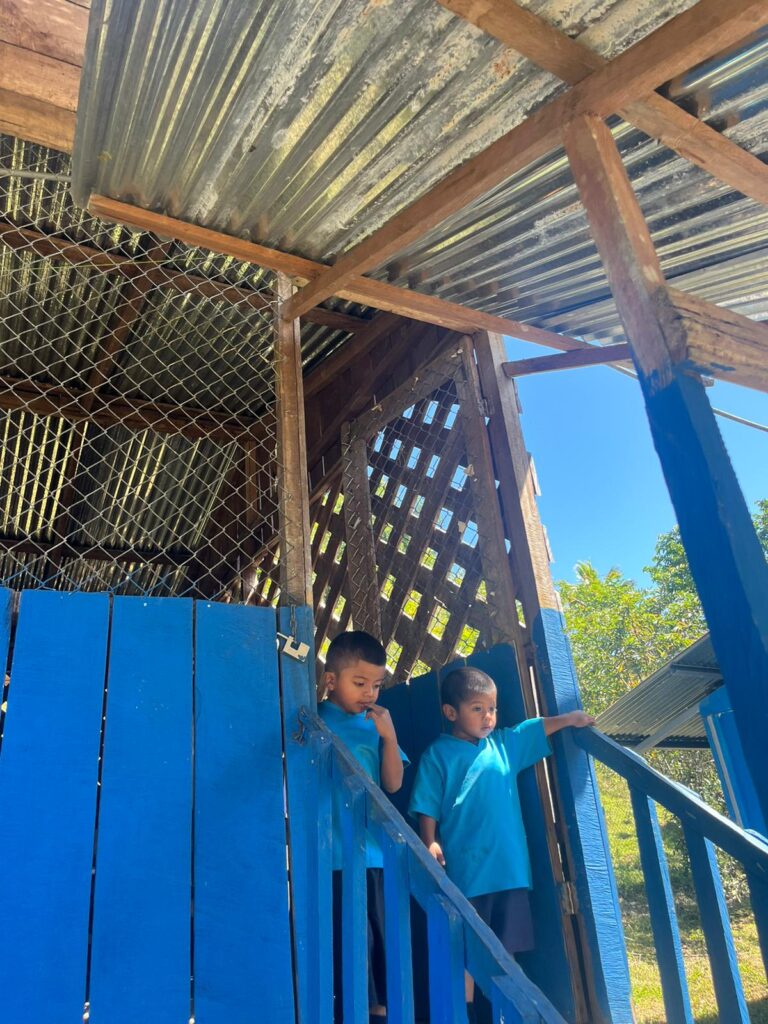 Children at doorway of house Costa Rica