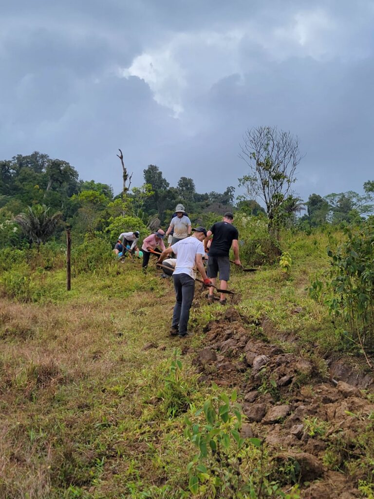 DWC volunteers in Costa Rica digging trench