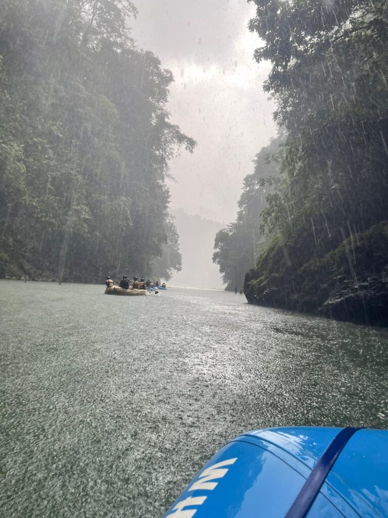 Volunteers river rafting in rain in Costa Rica