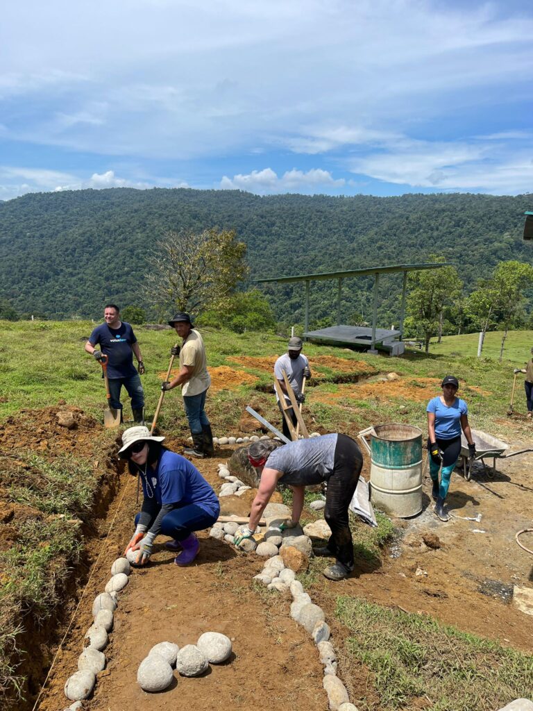 Salesforce volunteers working on rock pathway in Costa Rica