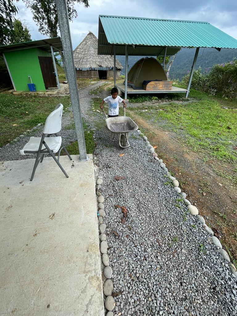 Local boy using wheelbarrow in Costa Rica