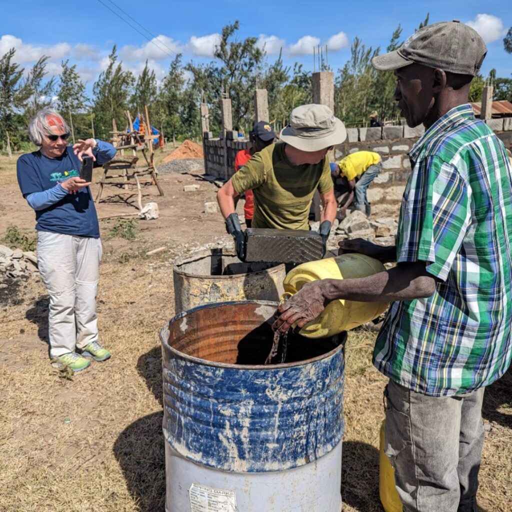 DWC volunteers working with steel barrels in Kenya