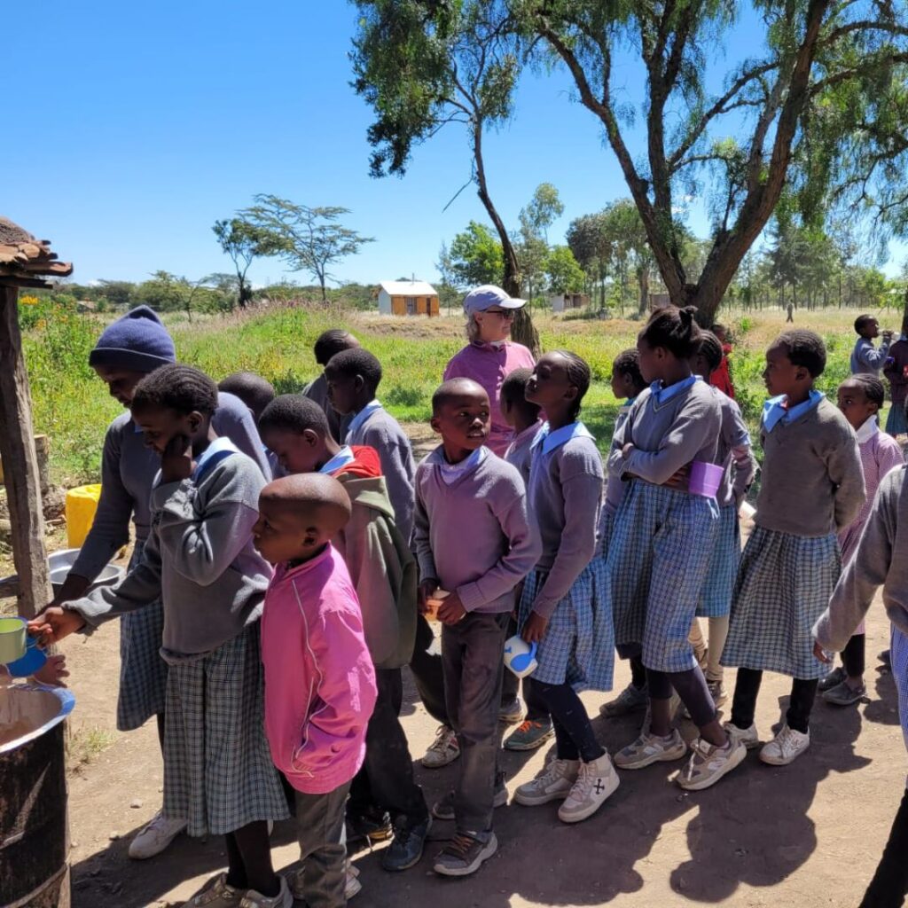 School kids lined up for water in Kenya
