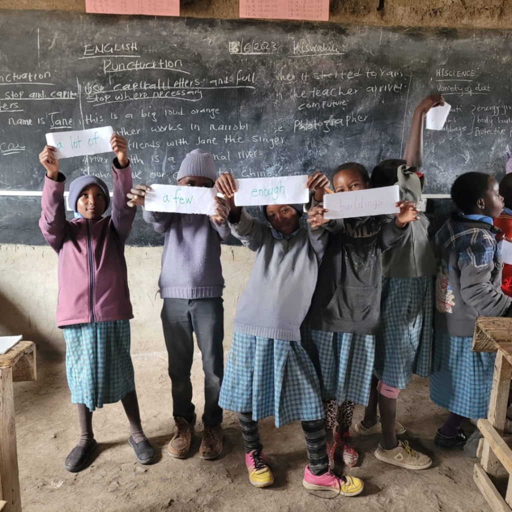 Schoolchildren Kenya holding signs