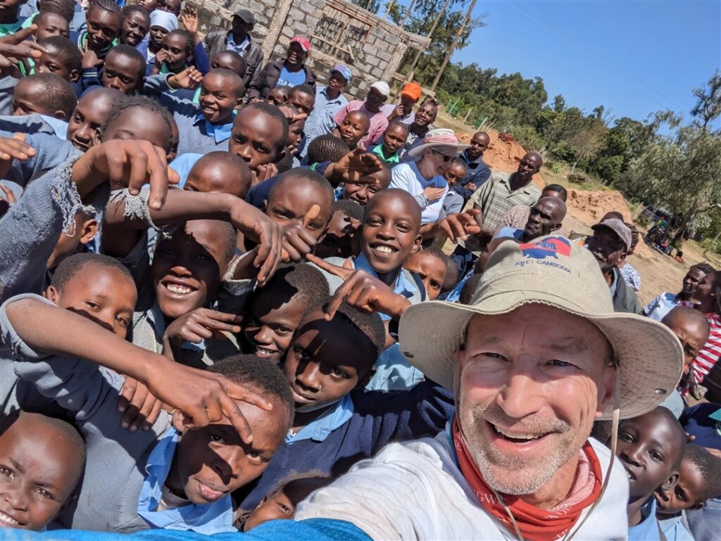 School kids outside Kenya with Team Leader