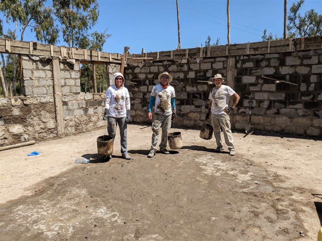 Dirty DWC volunteers at construction site Kenya