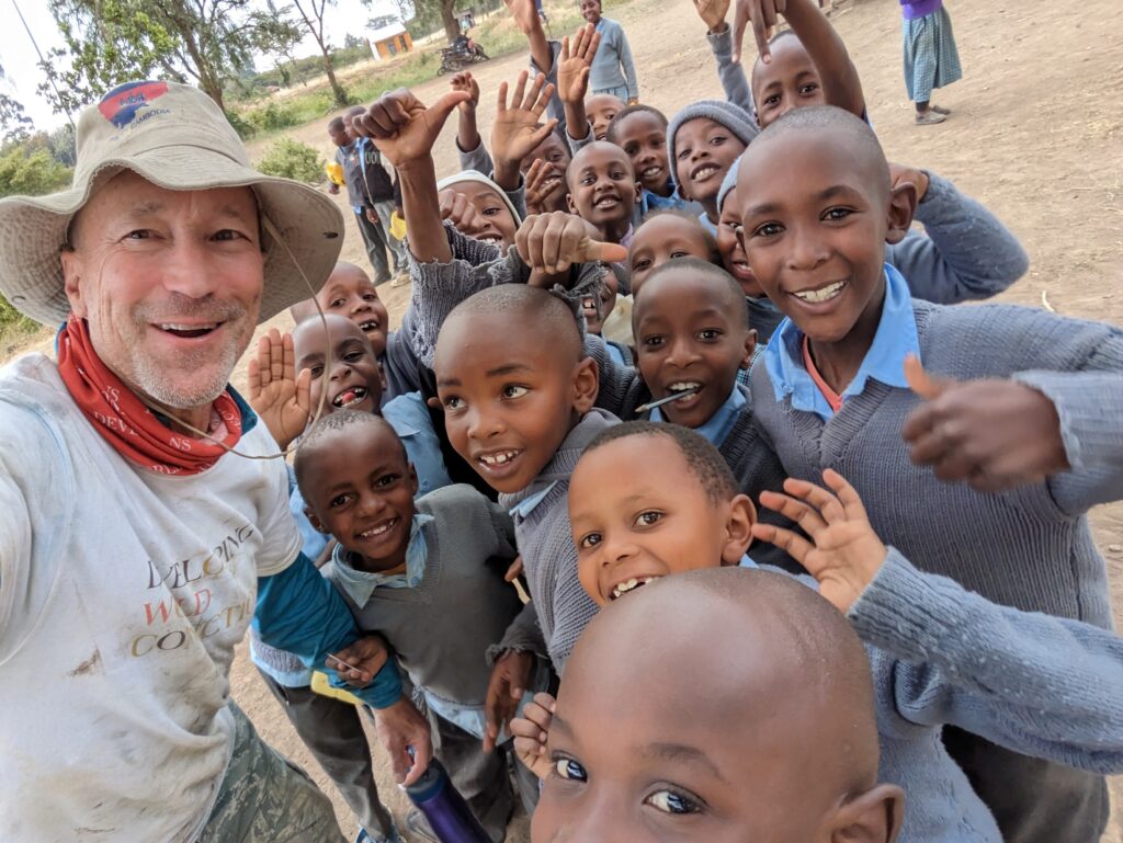 DWC Team Leader with schoolchildren Kenya