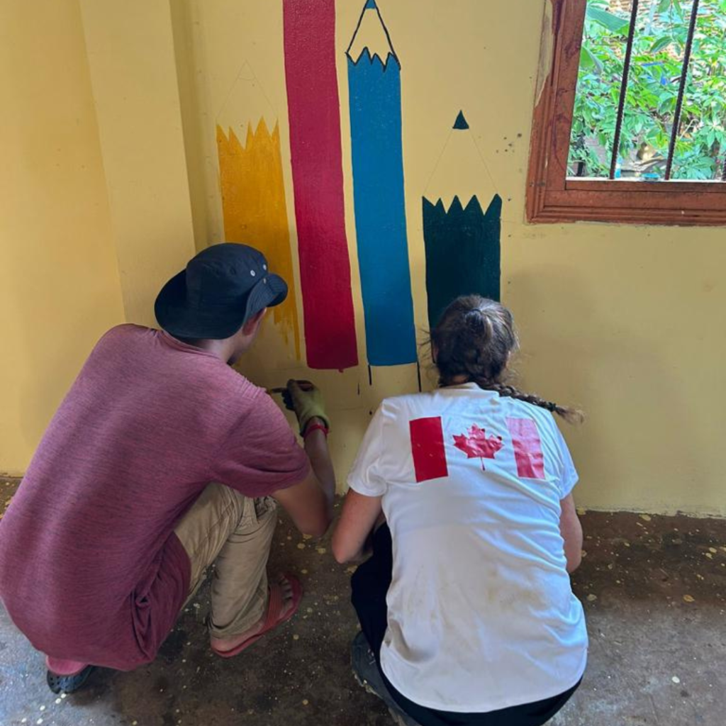 DWC volunteers painting school classroom Philippines