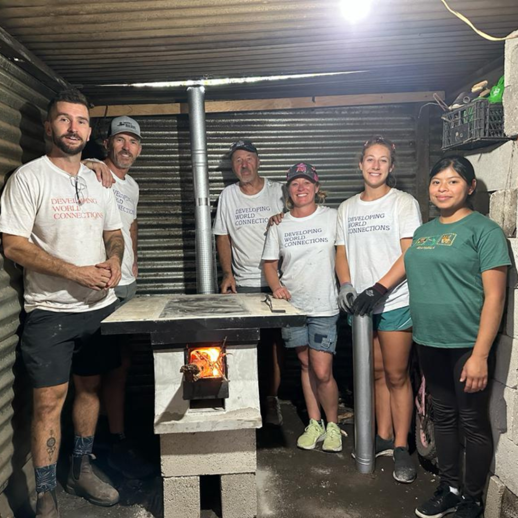 Volunteers and Guatemala family in front of installed eco stove