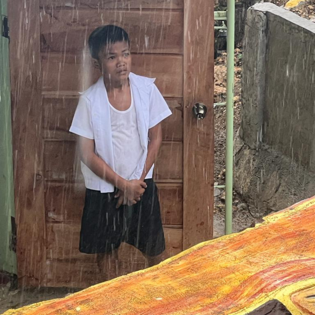 Filipino child in rain