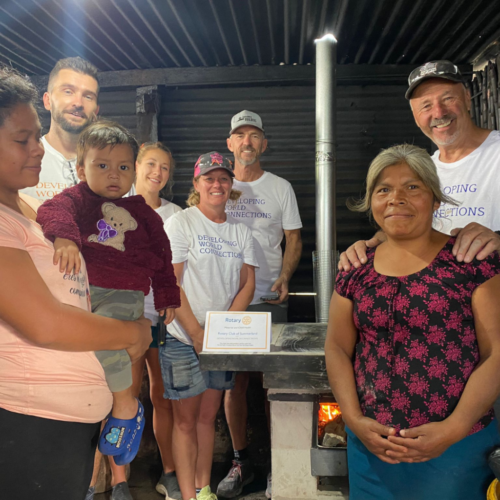 Volunteers and Guatemala family in front of installed eco stove