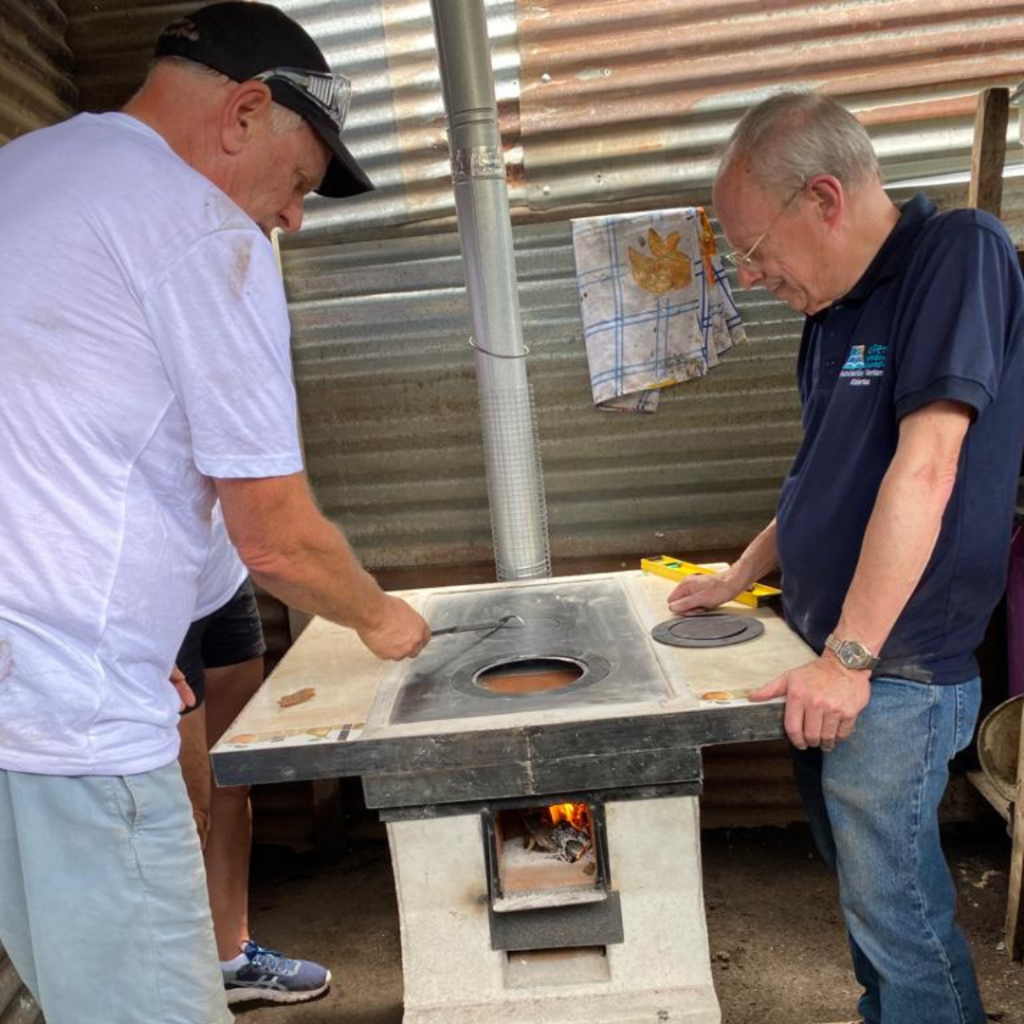 Volunteers testing newly installed eco stove Guatemala