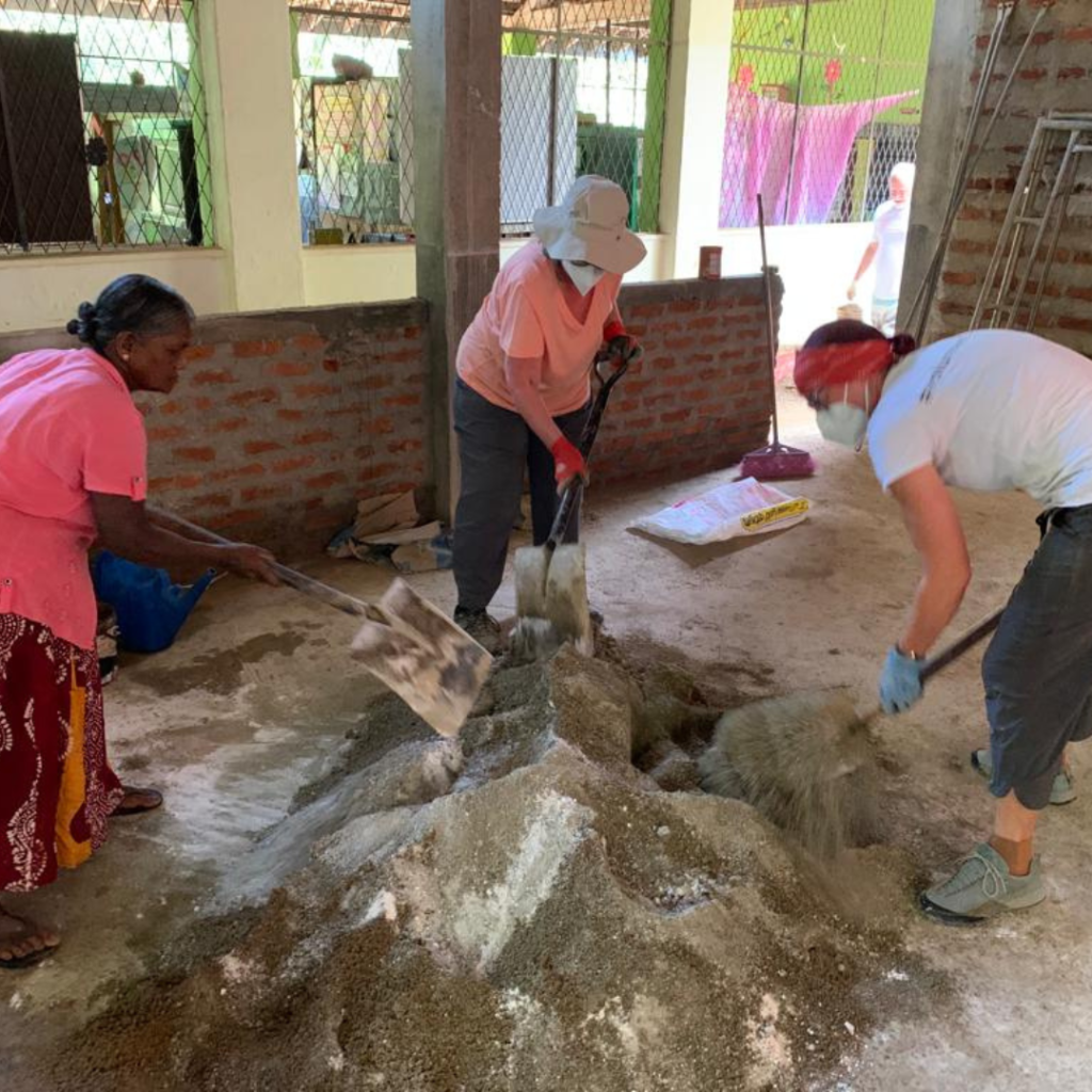 DWC volunteers mixing cement Sri Lanka