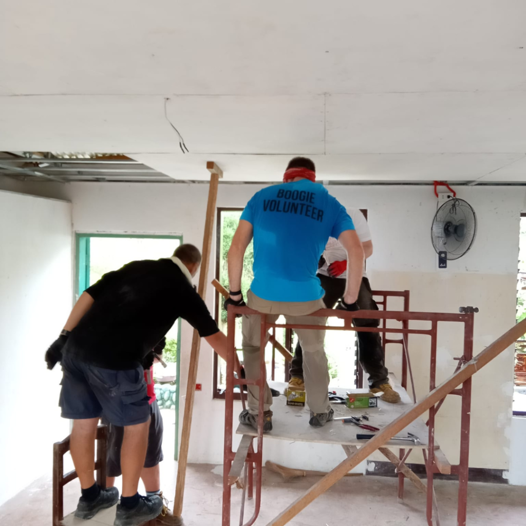 Volunteers installing ceiling drywall Philippines