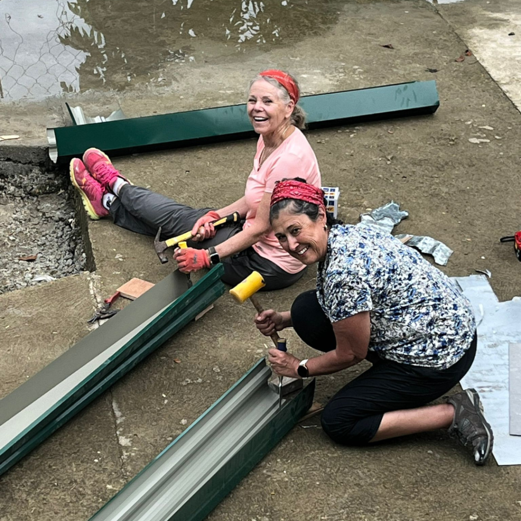 DWC volunteers putting up gutters Philippines