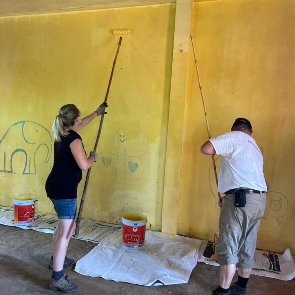 DWC volunteers painting school classroom Philippines