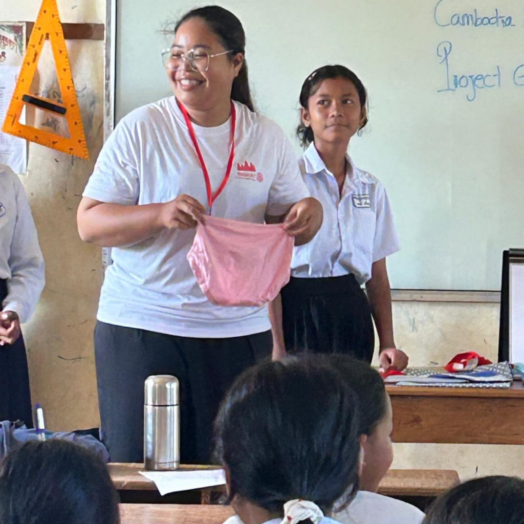 DWC volunteer discussing personal Hygiene with students Cambodia