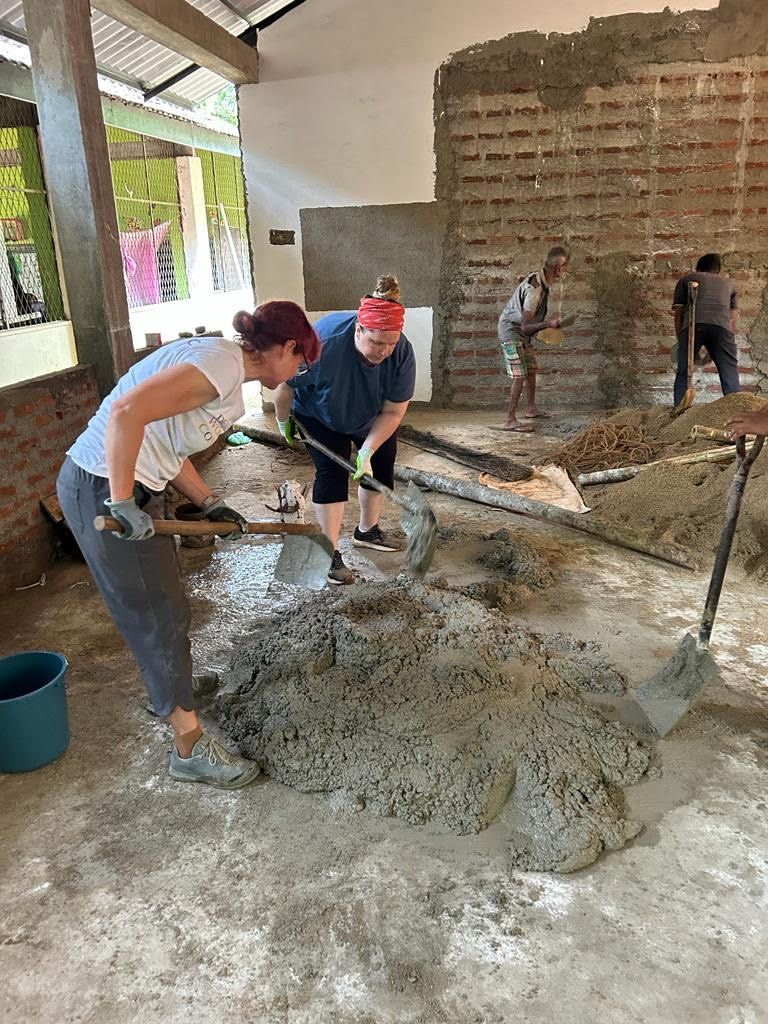 DWC volunteers mixing cement in Philippines