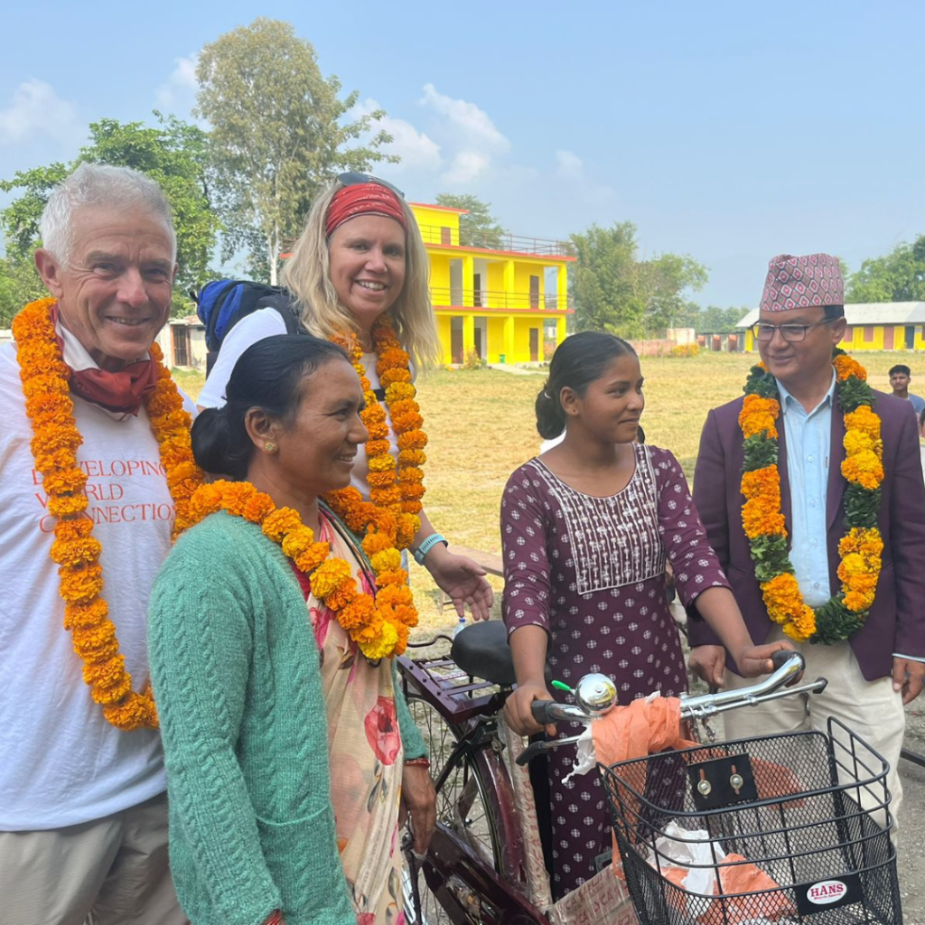 DWC volunteers with leis around necks Nepal