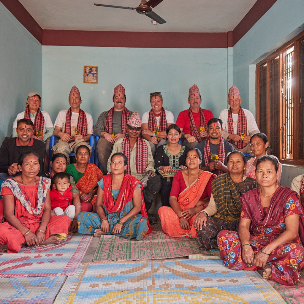 Volunteers and locals wearing traditional clothing Nepal