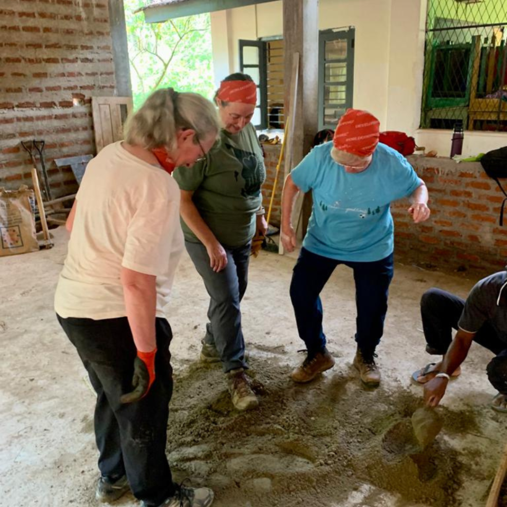 Volunteers in Sri Lanka mixing cement