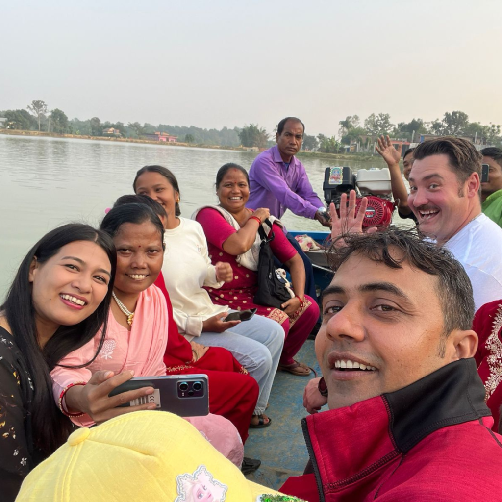 DWC volunteers on a boat Nepal