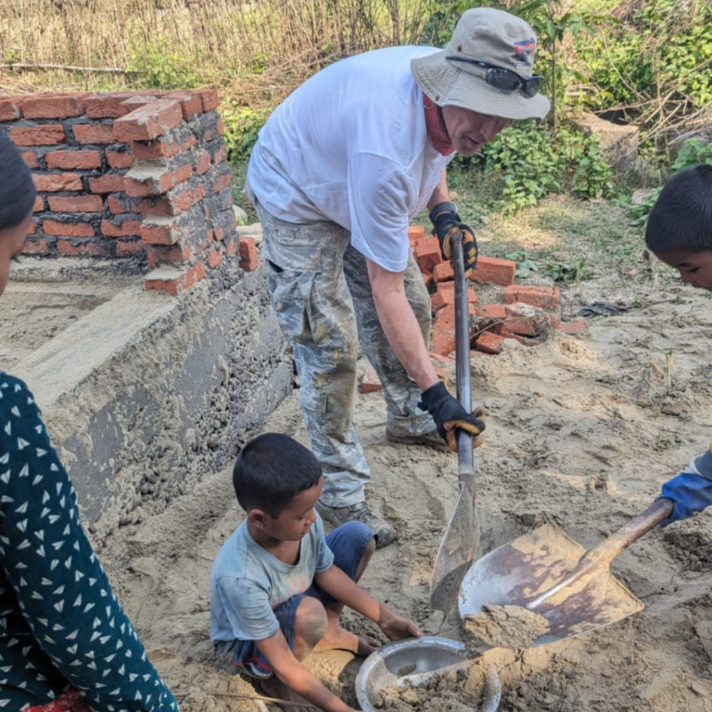 Marty France digging with children Nepal