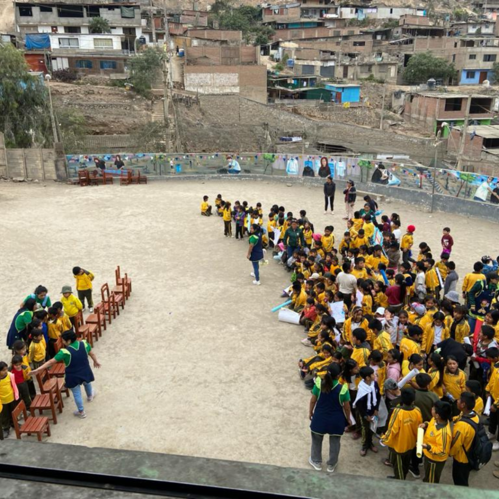 Schoolchildren assembled outside of San José Obrero School Peru