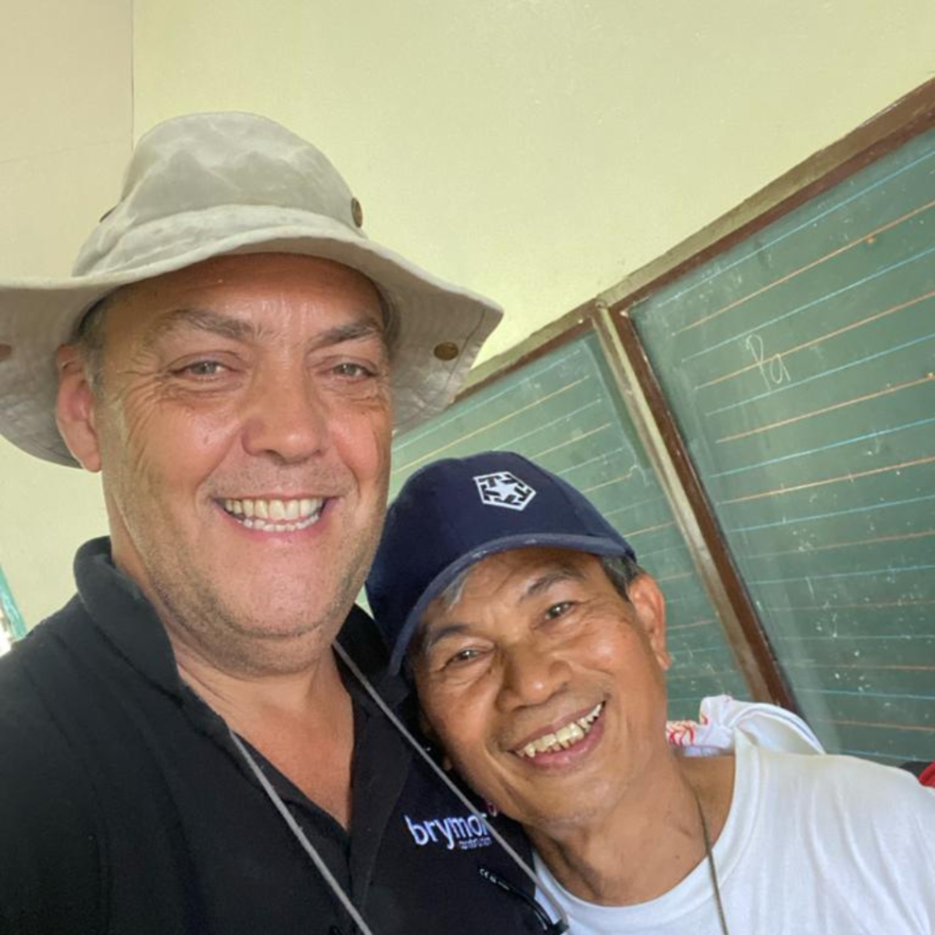 DWC volunteer posing with local both smiling Philippines