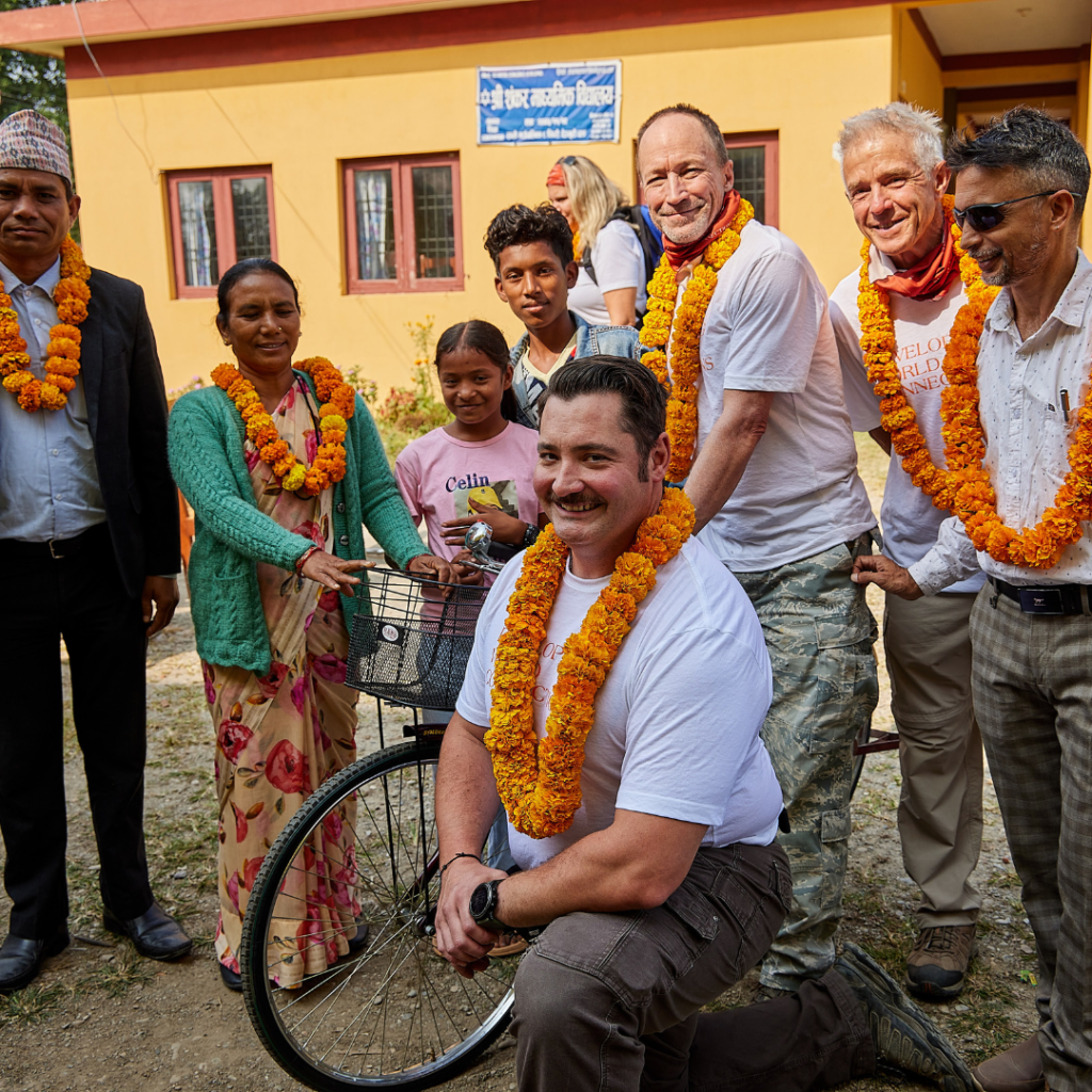 DWC volunteers with leis around necks Nepal