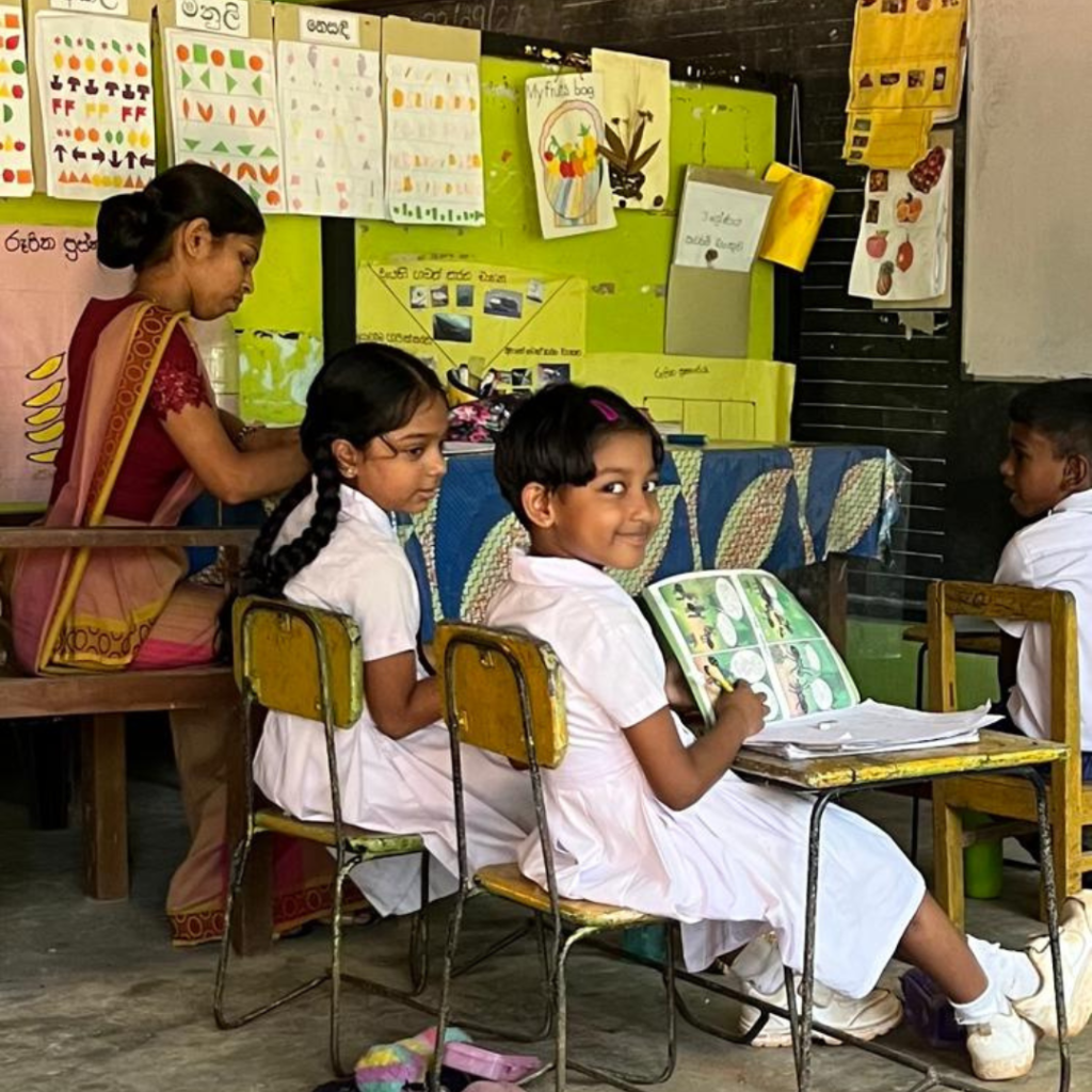 Children reading in classroom Sri Lanka