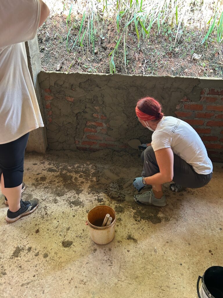 Volunteers in Sri Lanka mixing cement