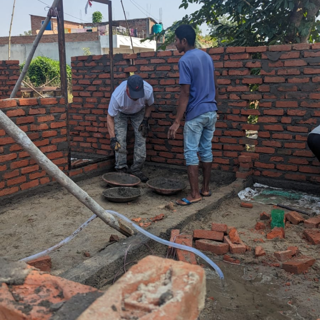 Local trades working on brick wall Nepal