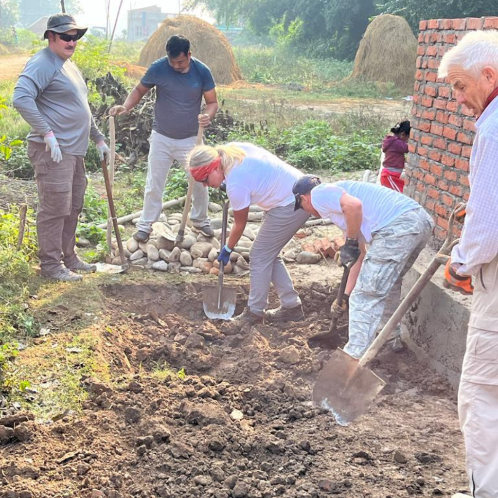 volunteers digging hole Nepal