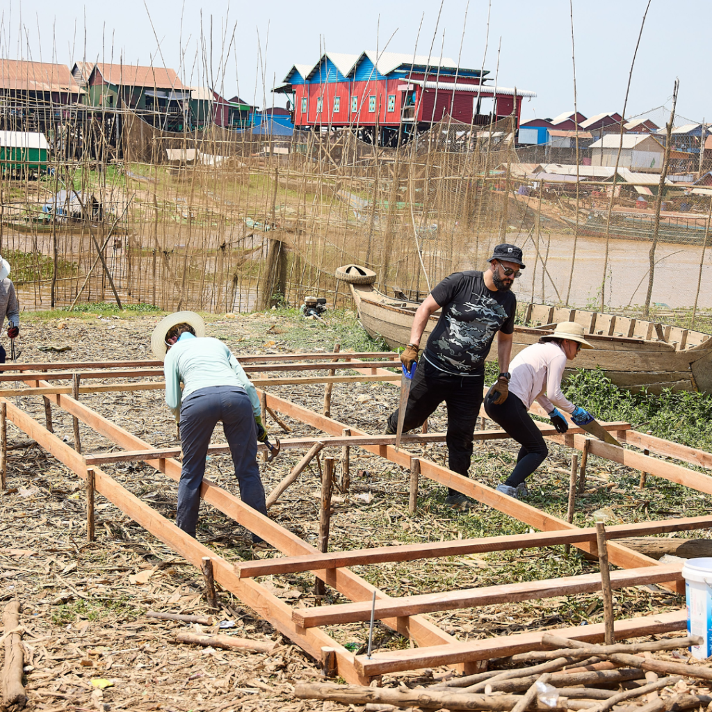 Volunteers building foundation for home Cambodia